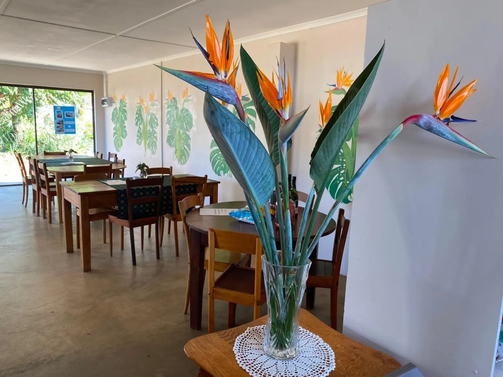 Tables and flowers inside the Kaffeestube